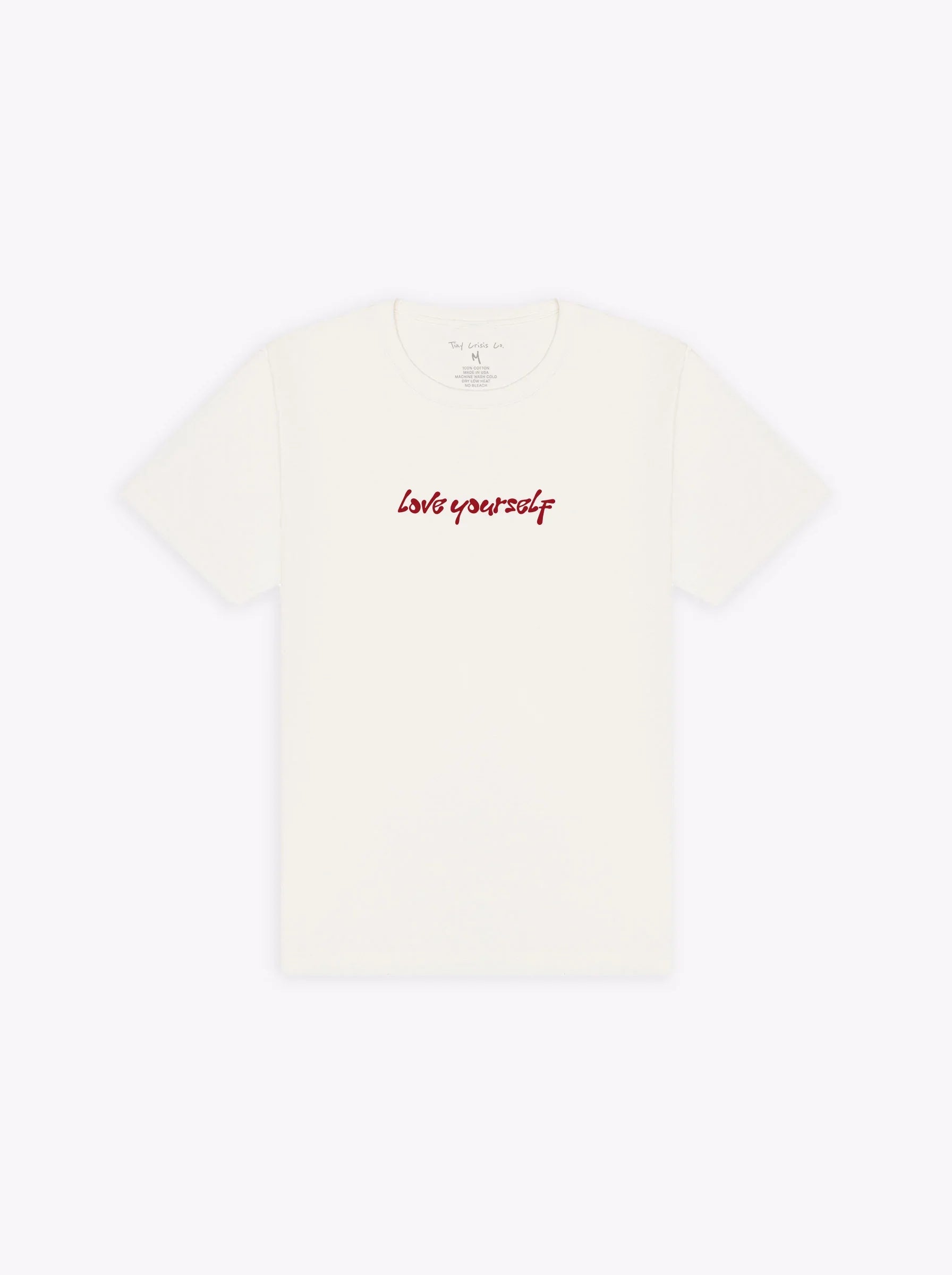 White t-shirt with 'love yourself' text in red on a white background