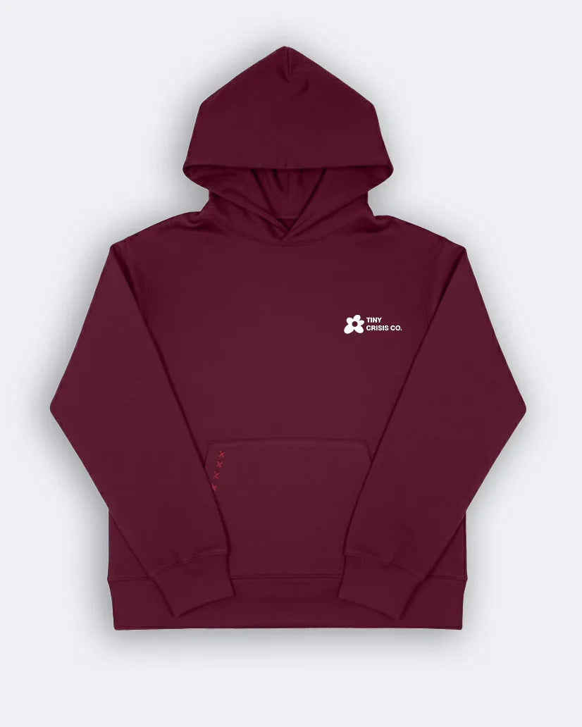 Maroon hoodie with a logo on the chest against a light gray background